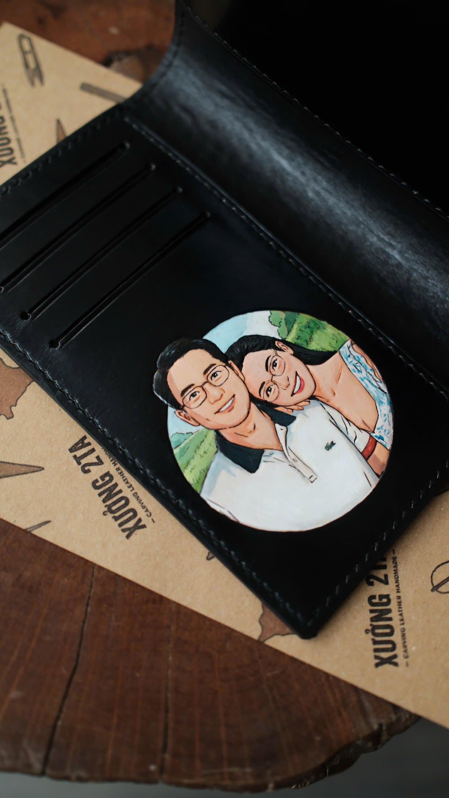 A black cat portrait carved into a personal Thornyx wallet